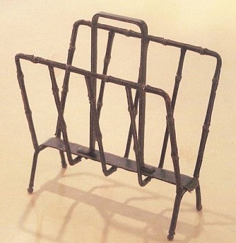 Jacques Adnet -&nbsp;Magazine rack, 1950 iron covered with hand sewn black leather and cream stitching by Hermes, brass details 19 1/2 x 17 x 11 inches ADN-002